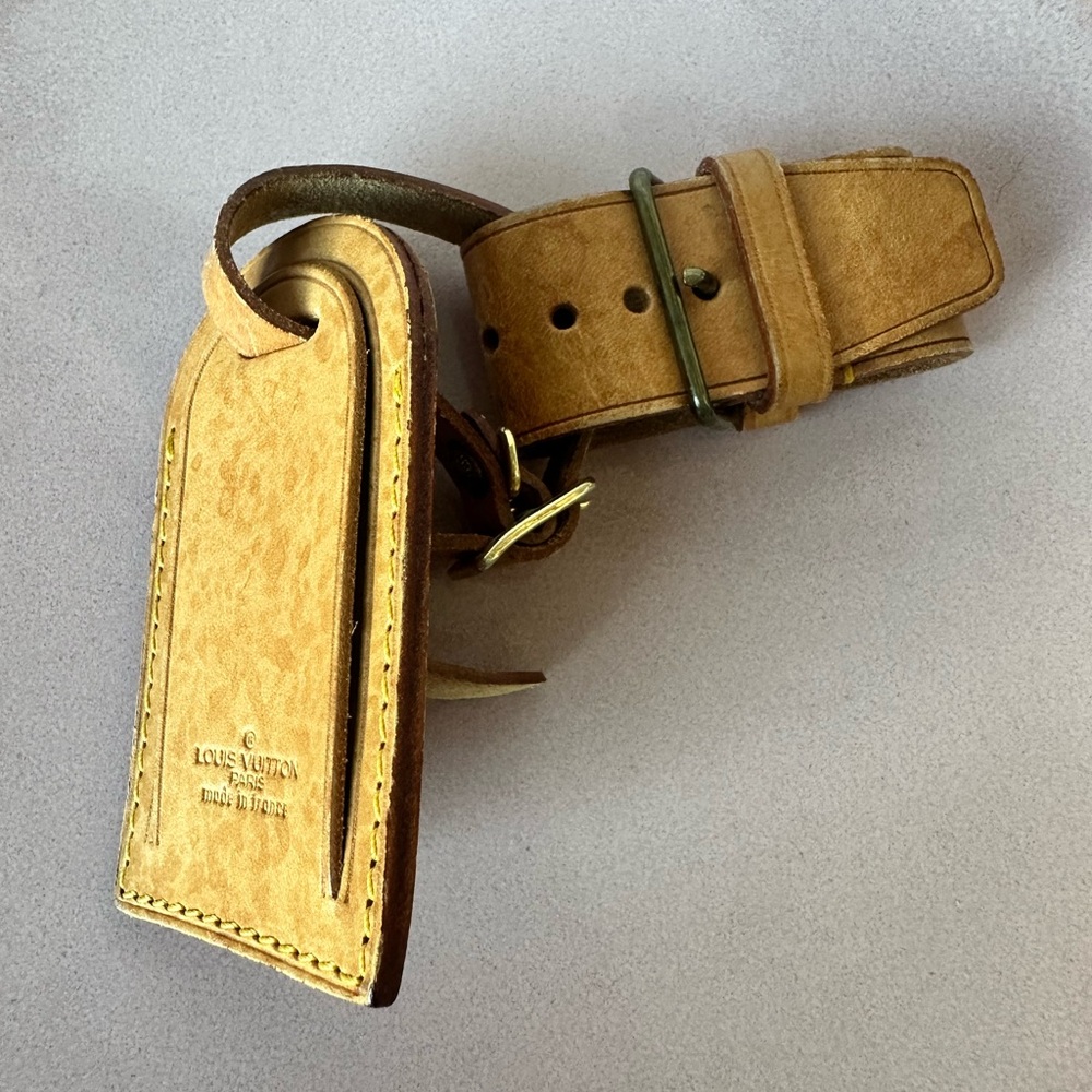 VINTAGE LOUIS VUITTON LUGGAGE TAG AND POIGNET
